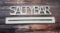 Preview: Schriftzug Saltybar mit/ohne Aufsteller aus Holz in weiß